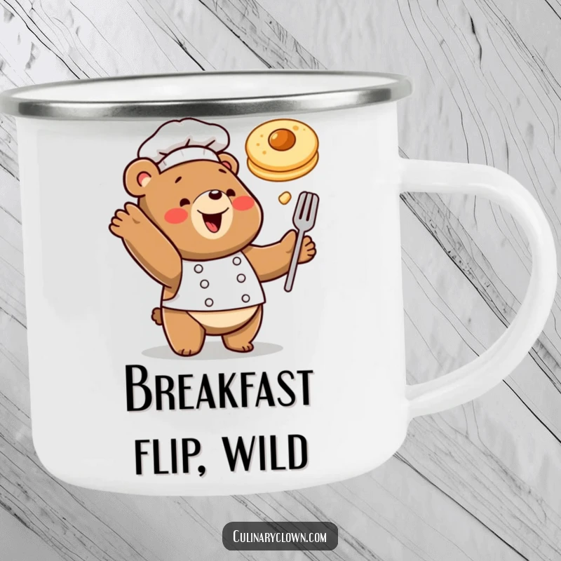 Funny camping mug showing a happy bear chef tossing a pancake, perfect for outdoor breakfast enjoyment.