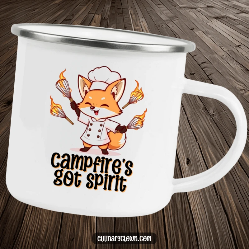 Funny enamel camping mug showcasing a determined fox chef juggling flaming whisks, perfect for enjoying drinks outdoors.