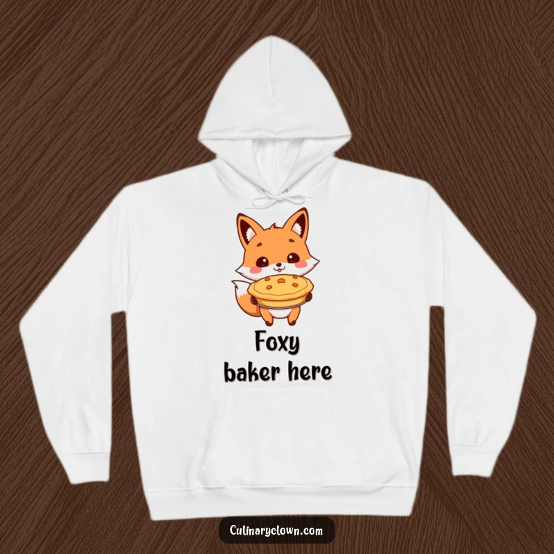Funny hoodie with a cheerful fox character proudly presenting a baked pie, perfect for cozy pie-loving sessions.