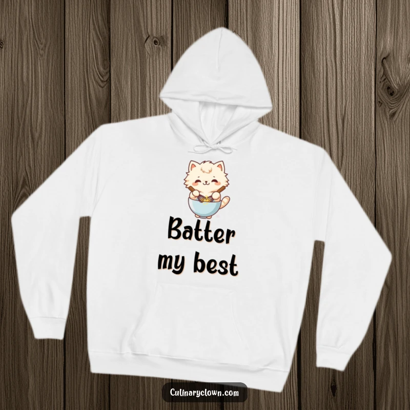 Funny kawaii cat character happily whisking batter in a bowl, wearing a cozy hoodie.