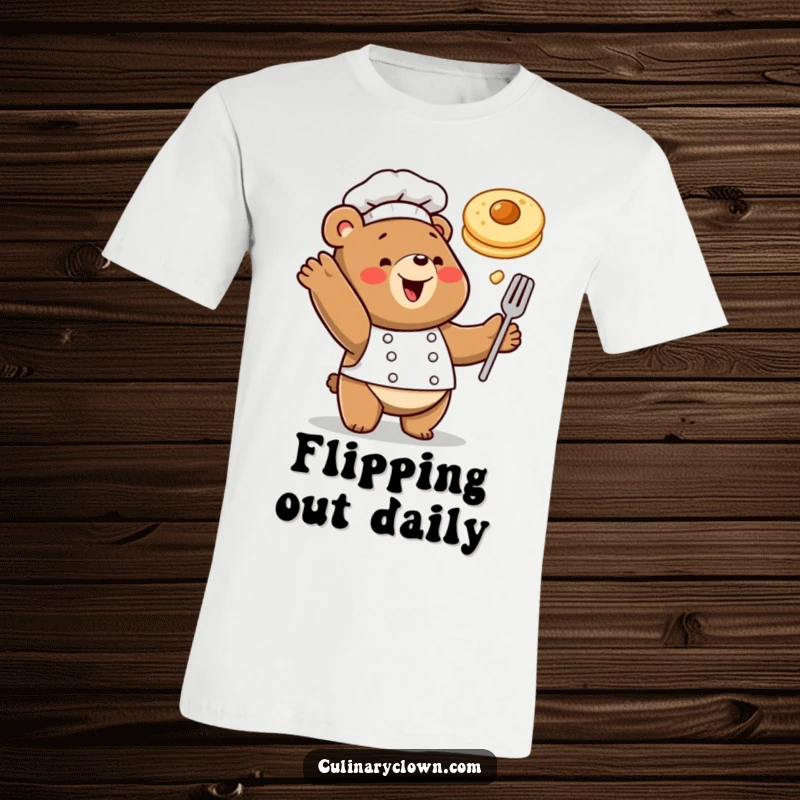 Funny t-shirt of a happy bear chef tossing a pancake in the air with playful enthusiasm, celebrating breakfast.