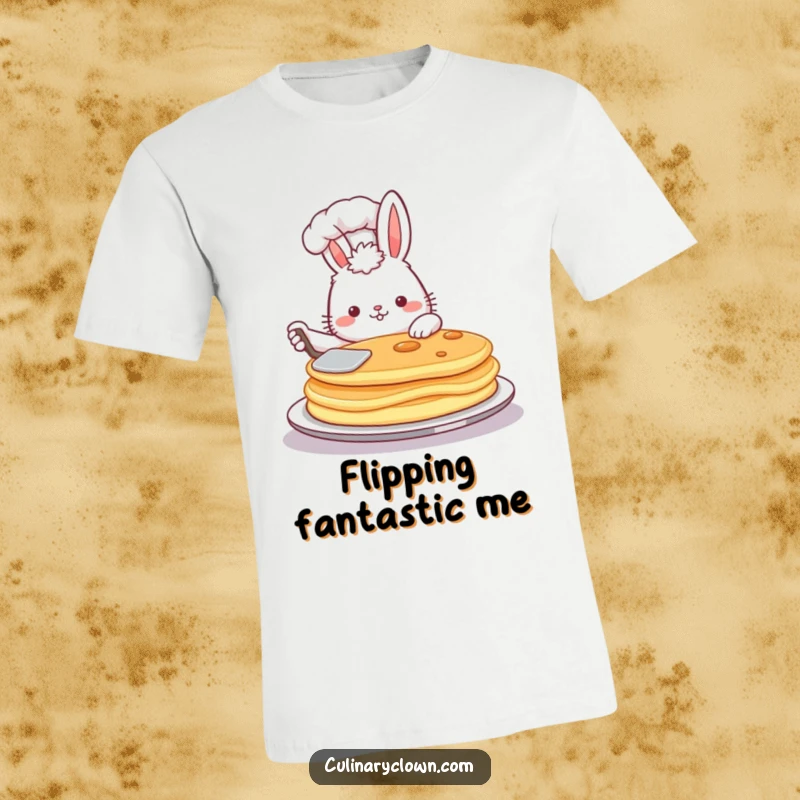Funny t-shirt graphic of a proud, fluffy bunny chef flipping a giant pancake high in the air with a spatula.