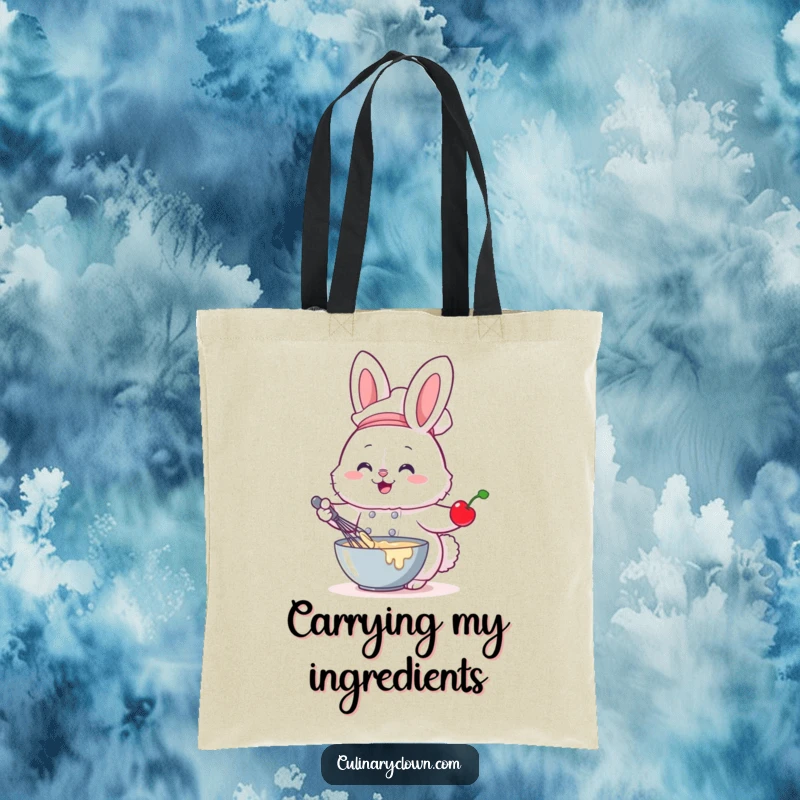 Funny tote bag with a fluffy bunny chef whisking batter with a cherry, perfect for carrying baking essentials.